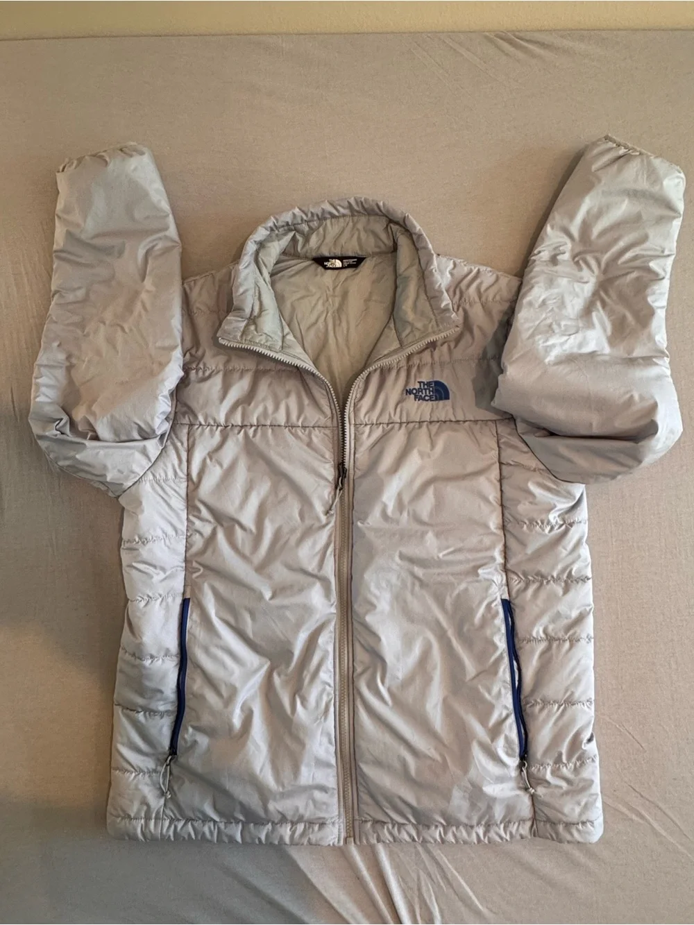 The North Face Light Gray Men's Puffer Jacket with Blue Accents